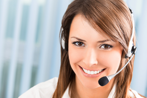 Closeup of a beautiful business customer service woman smiling